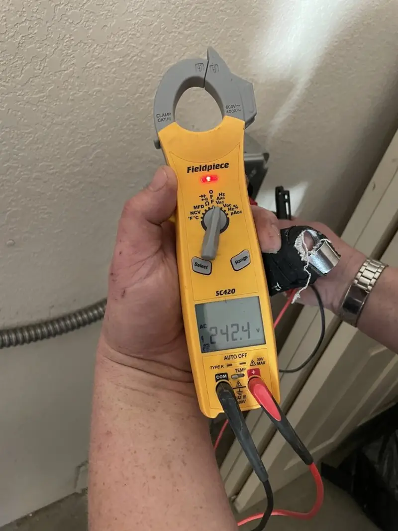 Voltage testing with clamp meter during Outlet Installation in Tooele